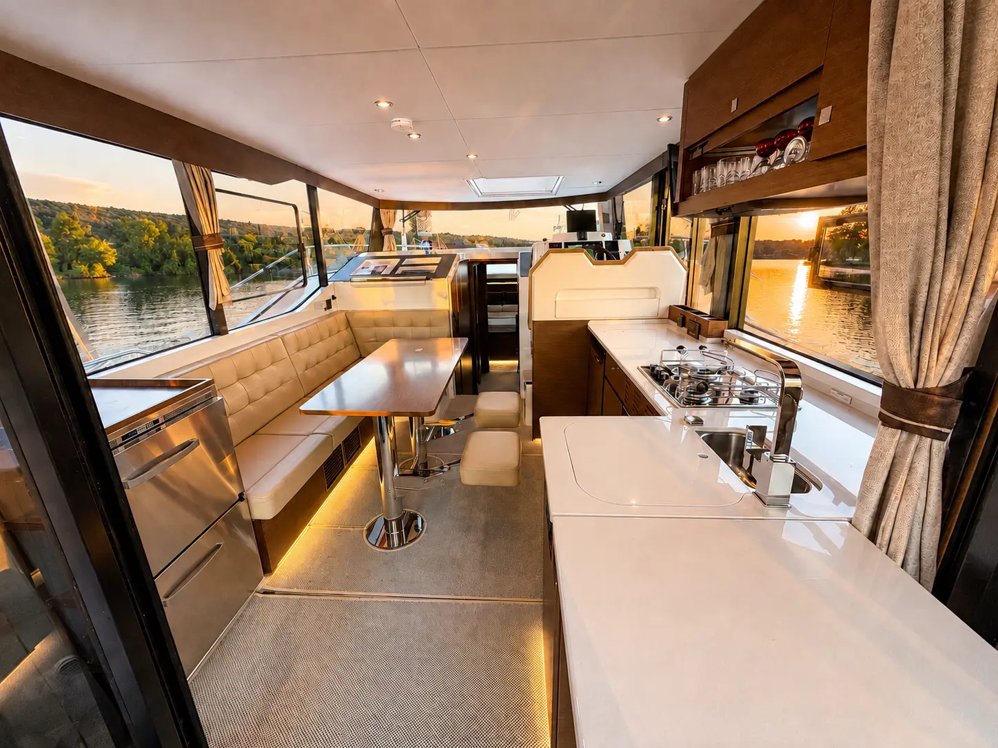 Salon, dinette and galley in golden hour light