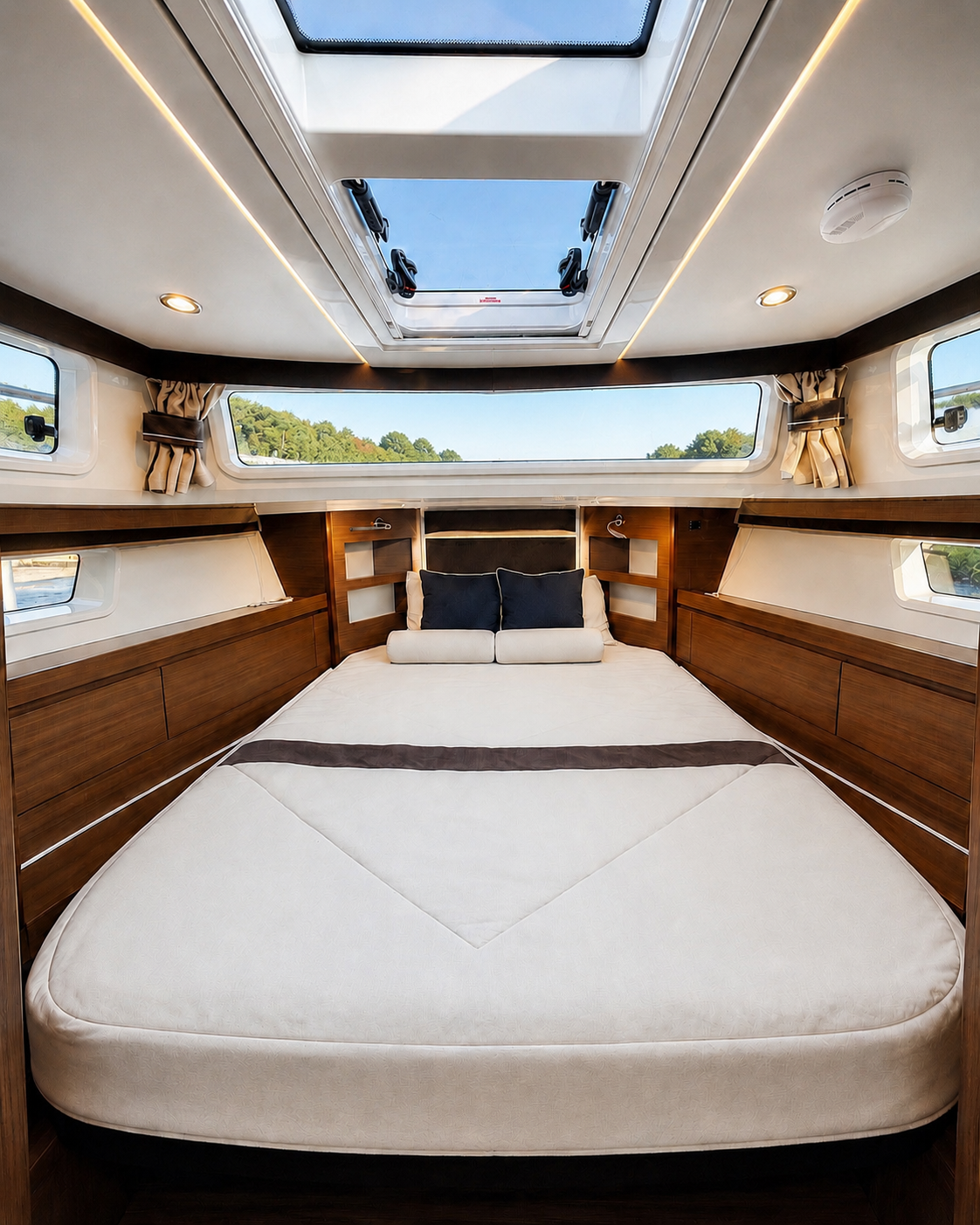 Master cabin aboard Crown of the Columbia with skylight and double berth