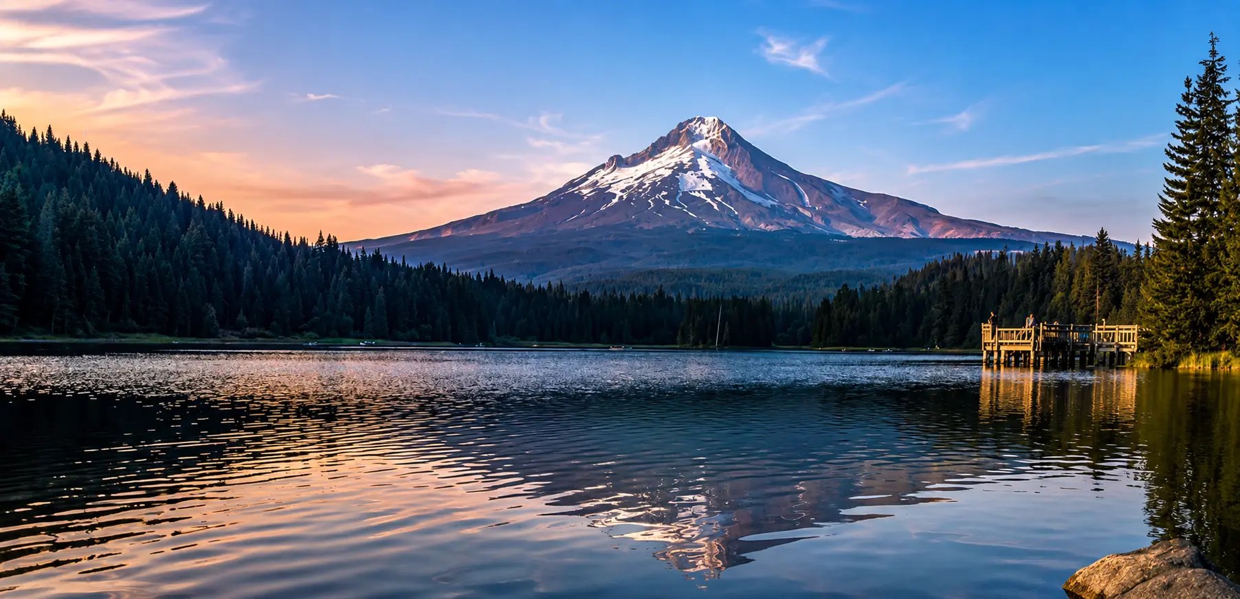 Mount Hood at sunset over still water