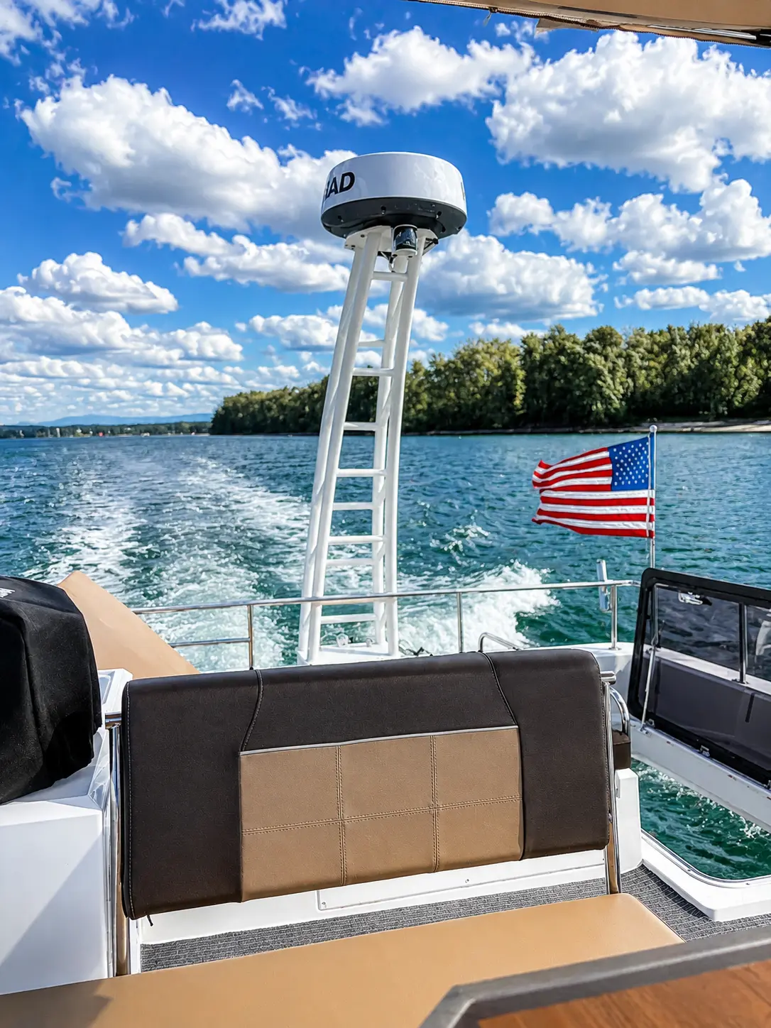 Aft deck underway with the wake astern and the flag flying